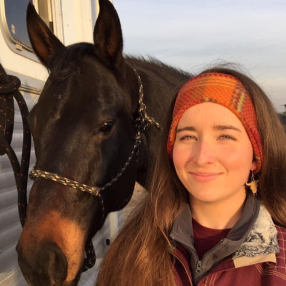 Jess Evans, founder of The Conservation Cowgirl, with her horse